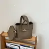 Bolso de mano de nicho estilo coreano para mujer, nuevo modelo 2026, bolso tipo cubo elegante y de lujo ligero, adecuado para ir al trabajo y uso casual, bolso cruzado con un bolso interior más pequeño