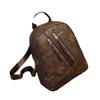 Mochila con textura de cuero suave 2023, nueva mochila de cuero PU estilo retro europeo y americano de gran capacidad, bolso de viaje sencillo para mujer