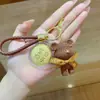 Llavero Oso Pastel Pequeño Oro Puro 999 Llavero Oso de Lana Muñeco Estéreo Colgante para Mochila de Pareja Regalo Lote