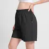 Shorts atléticos de corte solto para grávidas, com cordões ajustáveis para evitar pressão na barriga, adequados para Pilates e ioga, disponíveis em tamanhos grandes e de secagem rápida.