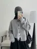 Elegante suéter de punto, suave pero bien estructurado, un cárdigan corto cómodo para otoño e invierno