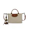 Bolso de Lona Transfronterizo Color-Blocking Tipo Bollo para Mujer 2026 Nuevo Estilo Bolso de Mano con Tapa Superior Bolso de Hombro Cruzado Versátil para Teléfono