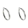 Estilo retro francés, pendientes de aro grandes de textura metálica única y exagerada para mujer, diseño elegante y simple con un ambiente fresco y minimalista.