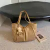 Bolsa tote plissada de nicho estilo coreano para mulheres, novo modelo outono 2026, bolsa de grande capacidade para estudantes universitários, bolsa de ombro para o dia a dia