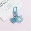 Llavero con hebilla de puerta giratoria, colgante de pentagrama y corazón transparente de colores, accesorio hecho a mano para bolsos