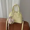 2026 Bolsa de Bolos Portátil Simple Estilo Nuevo Bolsa de Alta Gama Versátil Moderna Elegante Bandolera Cruzada Pequeña Cuadrada