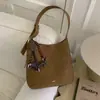Bolso de Mano Mujer 2026 Japón Otoño Invierno Versátil Moda Tote Colgante Coreano Viaje Cruzado Perro Pequeño Estilo Nuevo Bolso de Hombro Simple