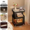 Mesita de noche para dormitorio en casa, modelo alternativo nuevo 2025, pequeña mesa auxiliar de metal forjado para sofá, estante de almacenamiento