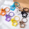 Llavero con Colgante de Campana de Estrella de Cinco Puntas de Colores Caramelo de Aleación Cubierta para Auriculares Decoración de Pareja