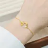 Pulsera Hebilla de Paz Flor de Loto Dorada Modelo Nuevo 2026 Lujo Ligero Elegante Exquisito Diseño de Nicho Pulsera Joyería