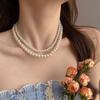 Collar de perlas retro francés para mujer, cadena de clavícula ligera de lujo con diseño de nicho, estilo popular 2025.