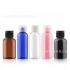 En stock venta al por mayor botella de plástico de 50 ml botella para loción PET botella transparente con tapa abatible tapa de mariposa botella para viaje