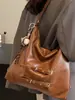 Bolsa de ombro única de cor sólida com nova textura transfronteiriça, bolsa de axila, mochila de grande capacidade moderna, bolsa tote alta e estilosa