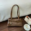 Bolsa de ombro estilosa estilo moto para mulheres, novo modelo 2026, bolsa de mão para o dia a dia, pequena bolsa tote para sair para o trabalho, bolsa baguette