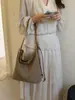 Bolso de Axila Texturizado Retro Transfronterizo Mochila para Mujer 2026 Nuevo Bolso Cubo Tejido Bolso de Hombro Cruzado Simple