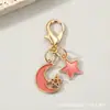Llavero combinado de pentagrama calado y luna creciente transfronterizo, colgante de mochila de estrella y luna de esmalte colorido con cierre de langosta, accesorio pequeño