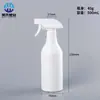 Botella de plástico con atomizador de 500 ml botella de empaque limpiador de manchas de aceite botella atomizadora botón de mano delicado botella con atomizador tipo pistola