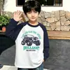 Camiseta de manga larga de algodón puro con bloques de color elegantes para niños de principios de primavera, estilo coreano, casual y versátil, con mangas raglán, adecuada para niños de mediana y mayor edad