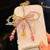 Cadena para Teléfono Móvil con Lazo de Perlas Super Hada Dulce Colorido Moda Femenina Lujo Accesible Colgante Corazón Girly Colgante Lindo Versátil
