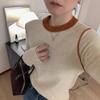 Camiseta de punto de cuello redondo con bloques de color de alta gama para mujer en otoño e invierno, suéter de punto ajustado de manga larga para usar como capa base