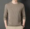 Camiseta para hombre de primavera 2023, nueva, juvenil, gofrada, color liso, manga larga, cuello redondo, básica casual, una pieza, entrega
