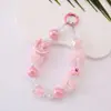 Cadena para teléfono de gato con pompón y cuentas para otoño e invierno, accesorio de muñeca moderno, accesorio para funda de teléfono de mujer, colgante llavero para bolso
