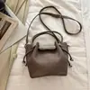Bolso de Hombro Individual de Textura de Alta Calidad a la Moda para el Trabajo Nuevo Otoño 2026 Versátil Bolso Cubo Elegante Bolso de Mano Cruzado de Moda