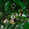 Campanilla de vaina de guisante colgante natural para coche cáscara de fruta de Yunnan sonido de campana agitada a mano terapia de sonido estilo bosque de plantas adorno colgante para coche bolso colgante otro
