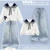 Nuevo conjunto de moda primavera y otoño para niños medianos y grandes: un conjunto de dos piezas que incluye un top de manga larga con cuello marinero y elegantes pantalones vaqueros
