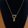 Collar de Acero de Titanio con Colgante de Corazón de Gama Alta y 26 Letras Inglesas para Mujer, Cadena para Clavícula con Apellido, Nicho de Lujo Ligero, Celebridad de Internet para Mejor Amiga