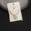 Nuevo Colgante Ping An de Bambú con Incrustaciones Doradas en Imitación de Jade Blanco Hebilla Ping An Collar Colgante de Pez Anual Accesorios de Joyería Colgante
