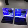Suporte de Exibição de Fichas de Acrílico de Alta Transparência para Venda por Atacado Suporte de Exposição de Produtos para Exposição Iluminado por LED Plataforma de Exibição com Fresagem e Impressão