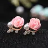 A8528 Aretes de flor de perla estilo coreano nuevos aretes de rosa de moda aretes de comercio exterior suministro femenino