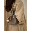 Bolsa de Balde Portátil Estilo Retrô Francês para Mulheres 2026 Inverno Novo Estilo Roupa Diária de Trabalho Bolsa de Ombro Nicho Casual Bolsa Transversal