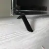 Base de Televisión de Plástico Negro de Fábrica de 24 32 40 43 Pulgadas con Tornillos de Base Empaquetada Individualmente