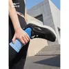 Zapatillas de correr para mujer Hongxing Erke 2026 nuevo modelo de verano, zapatillas deportivas transpirables de malla, zapatos negros para mujer con suela ligera y suave