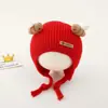 Bonitos y adorables gorros de otoño e invierno para niños, con diseño de poner, material de punto y una serie de dibujos animados, que brindan abrigo y protección para los oídos para bebés y niños pequeños.