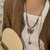 Collar Colgante de Campana de Cerámica Mariposa Estilo Étnico Vintage para Mujer, Nuevo Accesorio de Cadena Larga para Suéter de Moda 2025
