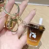 Chaveiro Pingente Laranja C Estilo Americano Luckin Coffee Tendência Mini Pingente de Areia Líquida Fofo Presente para Mochila Atacado