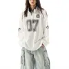 Camiseta de punto de manga larga estilo retro americano de nicho con cuello en V, holgada y versátil, para hombre. Tops de alta gama europeos y americanos para mujer.