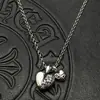Joyería de moda Plata tailandesa Retro Corazón de doble melocotón Collar de tumba Cadena de suéter Otoño e Invierno Personalizado de Europa y América Cruz de Alta Gama