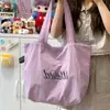 Bolso de hombro de estilo coreano inspirado en Instagram de alta apariencia para estudiantes, gran capacidad, ligero, casual, bolsa de mano para el día a día con logo estampado