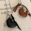 Collar Colgante de Corazón y Cruz de Cuero Maillard Cadena Larga con Borla para Suéter Diseño Dulce y Fresco Cadena para el Cuello