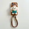 Funda de Teléfono Móvil de Peluche de Cachorro de Dibujos Animados Linda Manzana 17Promax iPhone16 Bolso 15 Anticaída 14 Creativa 13