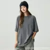Camiseta de cachemir minimalista y relajada de manga corta para mujer, silueta holgada, cuello redondo, top de punto versátil y favorecedor.