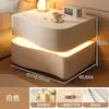 Mesita de noche color crema para dormitorio, uso creativo en el hogar, nueva moderna minimalista inteligente de alta gama con almacenamiento de madera maciza