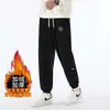 Calças de moletom de veludo cotelê para outono e inverno, calças casuais com retalhos, calças jogger masculinas de corte solto com forro de fleece e design espessado