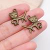 Mezcla de 20 colgantes pequeños de color bronce retro, bonitos colgantes de gato con forma de garra de gato, accesorios de joyería DIY.