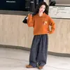 Suéter de punto con cuello polo para niña 2026 nuevo conjunto de pantalones de cuadros para niños conjunto de dos piezas casual británico para niños grandes primavera y otoño