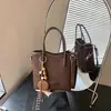 Bolso de cubo retro transfronterizo para mujer, 2026, de alta gama, elegante y moderno, adecuado para el trabajo diario, se puede llevar en la mano o usar como bolso de hombro o bolso cruzado